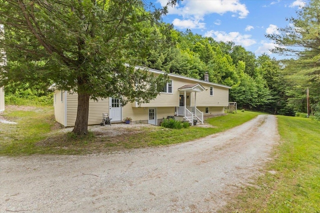 89 Catella Rd, Essex, VT 05452 - bi-level home with driveway and a chimney