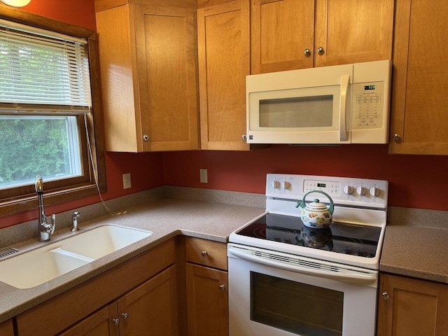 122 Batchelder St Unit A-8, Barre City, VT 05641 - kitchen with white appliances, brown cabinets, and light countertops