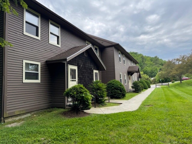 122 Batchelder St Unit A-8, Barre City, VT 05641 - view of side of home featuring a lawn