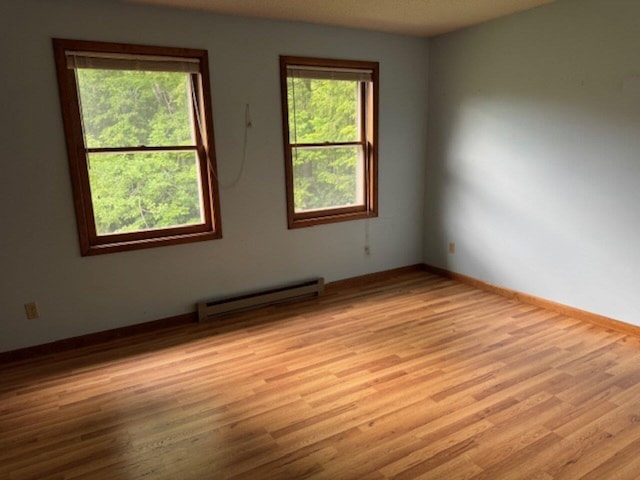 122 Batchelder St Unit A-8, Barre City, VT 05641 - unfurnished room with baseboard heating and light wood-type flooring