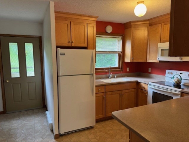122 Batchelder St Unit A-8, Barre City, VT 05641 - kitchen with white appliances, light countertops, and brown cabinetry