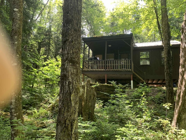 505 River Rd, Pittsburg, NH 03592 - rear view of house featuring a view of trees and a wooden deck