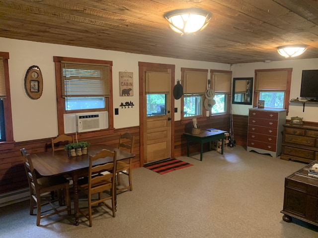 505 River Rd, Pittsburg, NH 03592 - dining room featuring cooling unit, a wainscoted wall, wooden ceiling, wooden walls, and carpet