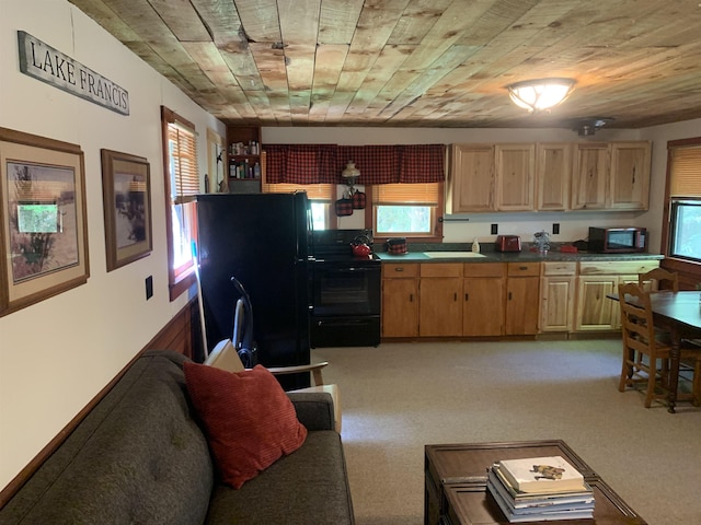 505 River Rd, Pittsburg, NH 03592 - kitchen featuring black appliances, light brown cabinets, dark countertops, wood ceiling, and light colored carpet