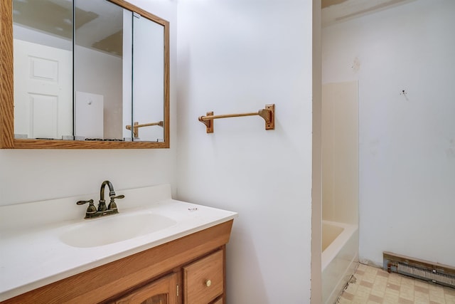 945 Mason Rd, Wilton, NH 03086 - bathroom featuring vanity, baseboard heating, and tile patterned floors