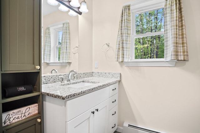 121 Deer Run Rd, Middleton, NH 03887 - bathroom featuring vanity, a baseboard heating unit, and a chandelier