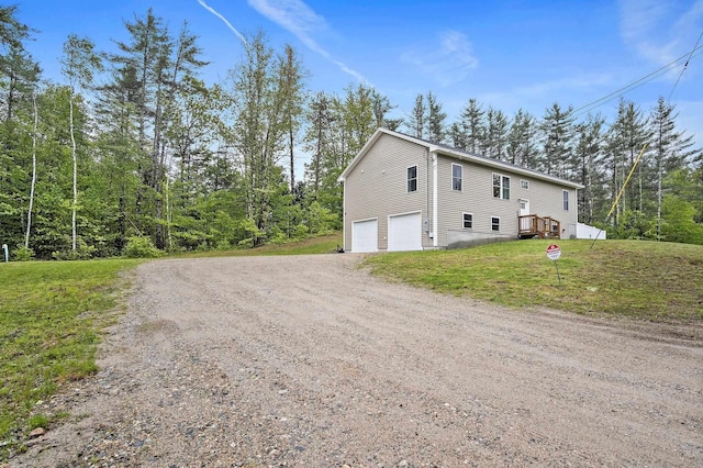 121 Deer Run Rd, Middleton, NH 03887 - view of home's exterior with driveway, an attached garage, and a yard