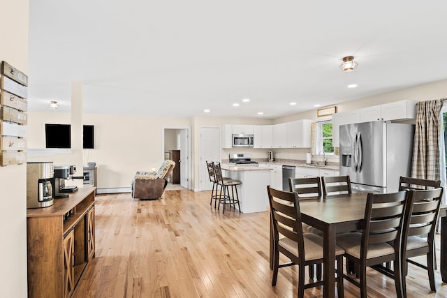121 Deer Run Rd, Middleton, NH 03887 - dining area featuring light wood-type flooring, a baseboard heating unit, and recessed lighting