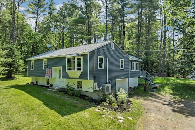 73 Tall Pine Rd, Farmington, NH 03835 - view of front of property with dirt driveway, a front lawn, and a garage