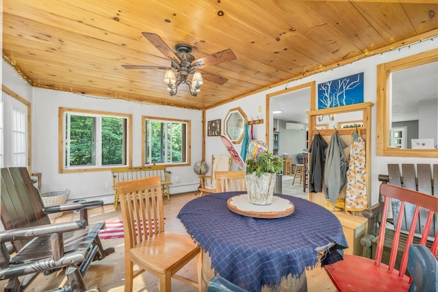 73 Tall Pine Rd, Farmington, NH 03835 - dining room with wooden ceiling, ceiling fan, a wall mounted air conditioner, and wood finished floors