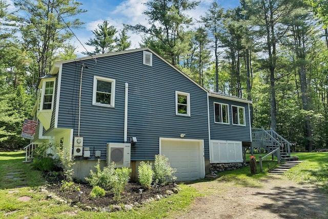 73 Tall Pine Rd, Farmington, NH 03835 - view of side of property with driveway and a garage