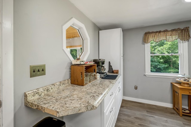 73 Tall Pine Rd, Farmington, NH 03835 - kitchen with wood finished floors, white cabinetry, and light countertops