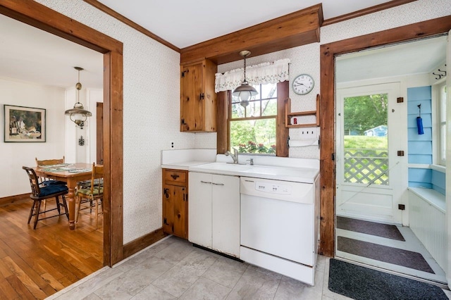 26 Colony Cove Rd, Durham, NH 03824 - kitchen featuring dishwasher, wallpapered walls, ornamental molding, light countertops, and decorative light fixtures