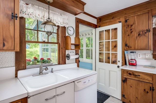 26 Colony Cove Rd, Durham, NH 03824 - kitchen with dishwasher, light countertops, and brown cabinets