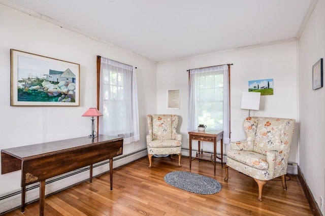 26 Colony Cove Rd, Durham, NH 03824 - living area with ornamental molding, light wood-style flooring, and a baseboard radiator