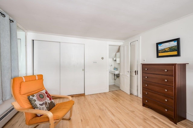 26 Colony Cove Rd, Durham, NH 03824 - sitting room with a baseboard radiator and light wood-style floors
