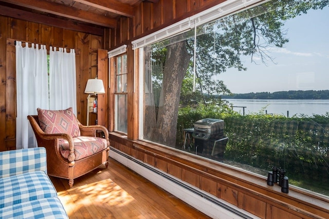 26 Colony Cove Rd, Durham, NH 03824 - sunroom with a water view, a baseboard radiator, wooden walls, wood finished floors, and beamed ceiling