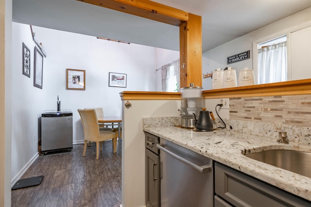1 Harwich Ct, Merrimack, NH 03054 - kitchen featuring stainless steel dishwasher, dark wood-style floors, light stone countertops, decorative backsplash, and plenty of natural light