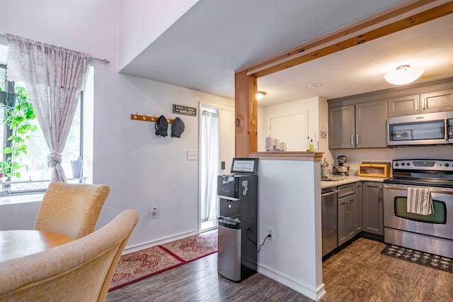1 Harwich Ct, Merrimack, NH 03054 - kitchen with appliances with stainless steel finishes, gray cabinetry, dark wood-style floors, and light countertops