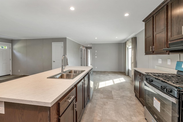 106 Stevens Rd Unit 1, Effingham, NH 03882 - kitchen with black gas stove, light countertops, a center island with sink, recessed lighting, and dark brown cabinets