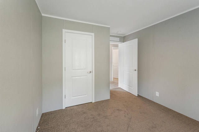 106 Stevens Rd Unit 1, Effingham, NH 03882 - unfurnished bedroom with carpet floors and crown molding