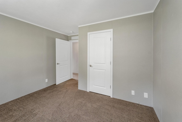 106 Stevens Rd Unit 1, Effingham, NH 03882 - unfurnished bedroom featuring carpet floors and crown molding