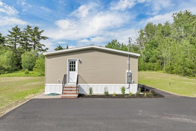 106 Stevens Rd Unit 1, Effingham, NH 03882 - view of home's exterior with entry steps and a lawn