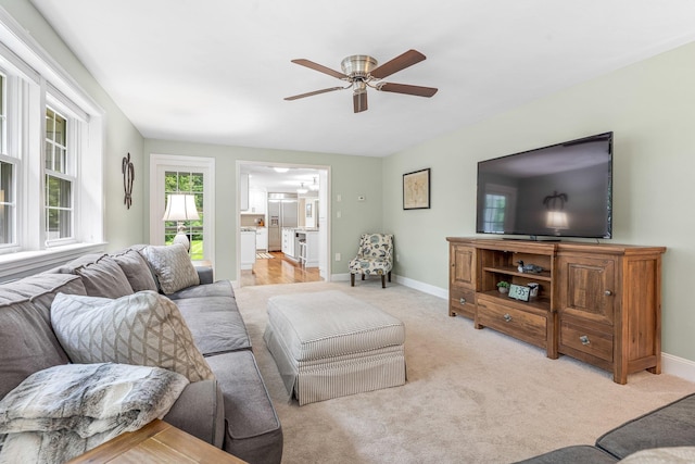 65 Forest St, Londonderry, NH 03053 - living room featuring ceiling fan and light colored carpet