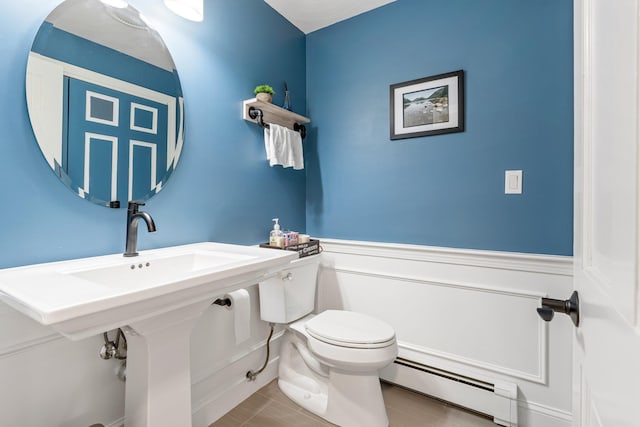 65 Forest St, Londonderry, NH 03053 - bathroom featuring baseboard heating and wainscoting