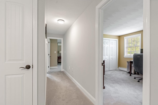 65 Forest St, Londonderry, NH 03053 - hallway with carpet flooring, an office area, and baseboard heating