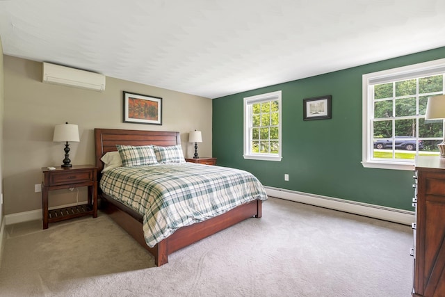 65 Forest St, Londonderry, NH 03053 - bedroom featuring a baseboard radiator, an AC wall unit, and carpet floors