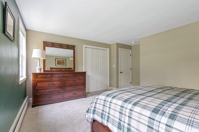 65 Forest St, Londonderry, NH 03053 - bedroom with baseboard heating, light colored carpet, and a closet