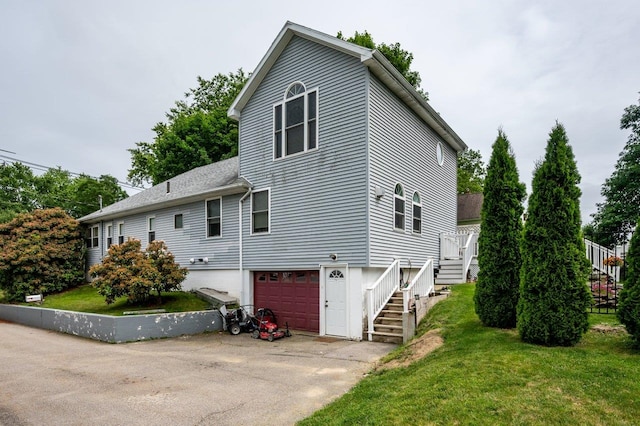 57 Rutland St, Dover, NH 03820 - view of home's exterior featuring stairs, an attached garage, a lawn, and driveway