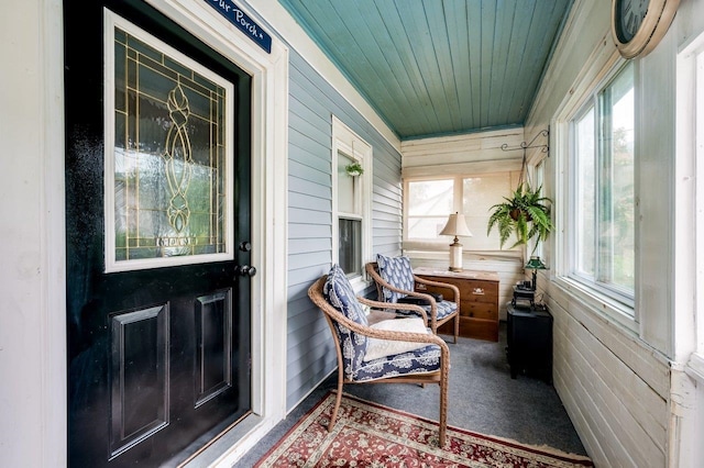 57 Rutland St, Dover, NH 03820 - sunroom featuring wooden walls, wood ceiling, and carpet