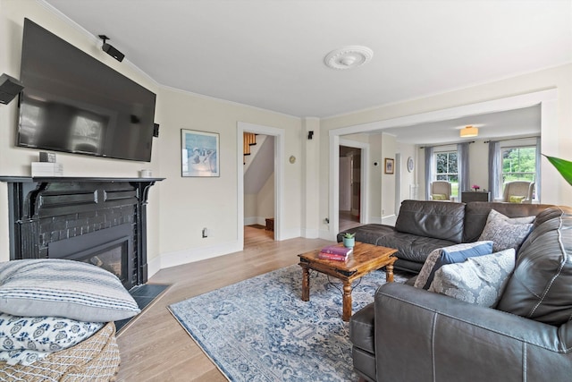 261 Main Ave, South Hampton, NH 03827 - living area featuring stairway, wood finished floors, and a glass covered fireplace
