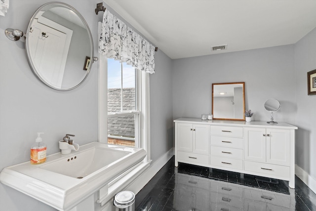 261 Main Ave, South Hampton, NH 03827 - bathroom with baseboards and vanity