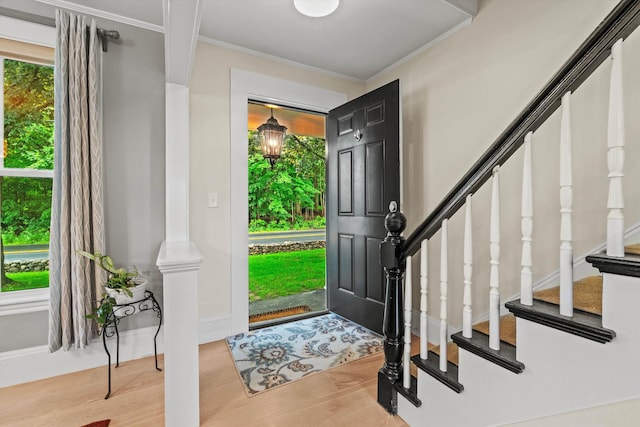 261 Main Ave, South Hampton, NH 03827 - entryway with crown molding, wood finished floors, and stairway