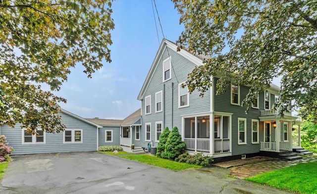 261 Main Ave, South Hampton, NH 03827 - back of house with a porch