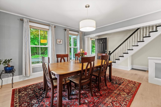 261 Main Ave, South Hampton, NH 03827 - dining area featuring stairway, ornamental molding, and light wood-style flooring
