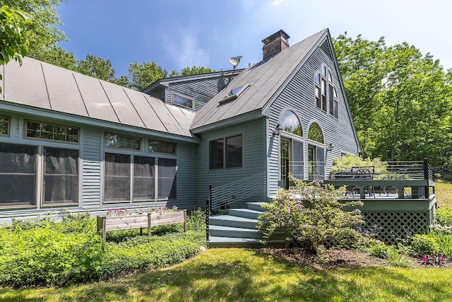 3440 Rte 44, West Windsor, VT 05037 - back of house featuring a deck, a chimney, a standing seam roof, and a metal roof