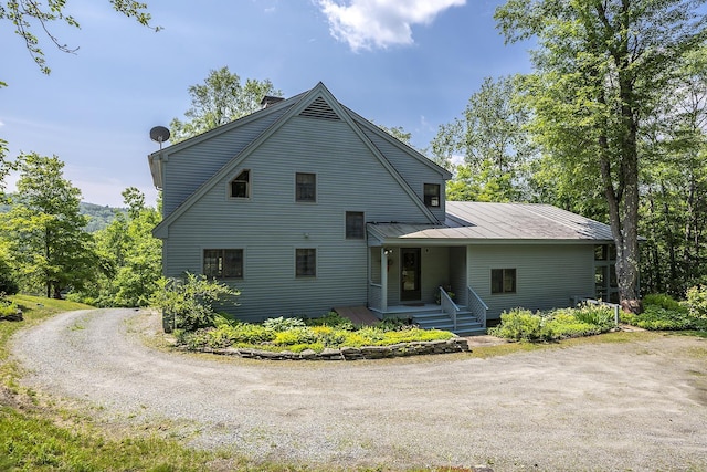 3440 Rte 44, West Windsor, VT 05037 - view of front of house with driveway, a metal roof, and a standing seam roof