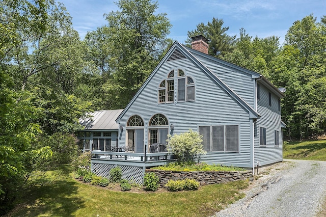 3440 Rte 44, West Windsor, VT 05037 - view of front of property featuring a chimney, a deck, and a front yard