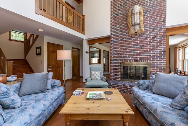 3440 Rte 44, West Windsor, VT 05037 - living area featuring a high ceiling, stairway, a brick fireplace, and wood finished floors