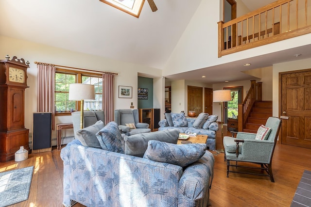 3440 Rte 44, West Windsor, VT 05037 - living room with healthy amount of natural light, wood finished floors, stairs, and high vaulted ceiling