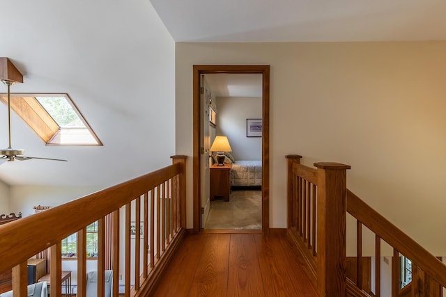 3440 Rte 44, West Windsor, VT 05037 - corridor with hardwood / wood-style flooring, an upstairs landing, a skylight, and healthy amount of natural light