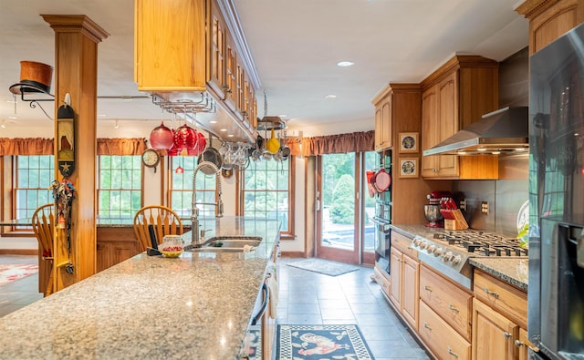 9 Oak Ridge Rd, Kensington, NH 03833 - kitchen featuring stainless steel gas cooktop, plenty of natural light, tasteful backsplash, wall chimney range hood, and recessed lighting