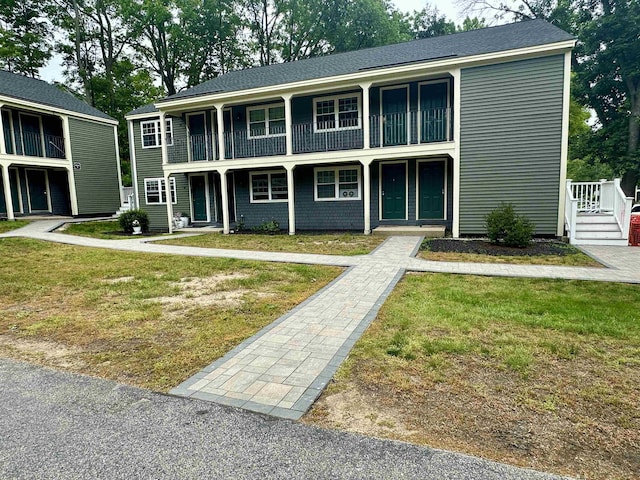 87 Cricketbrook Rd Unit 87, Dover, NH 03820 - view of front of house with a balcony, a front yard, and a porch