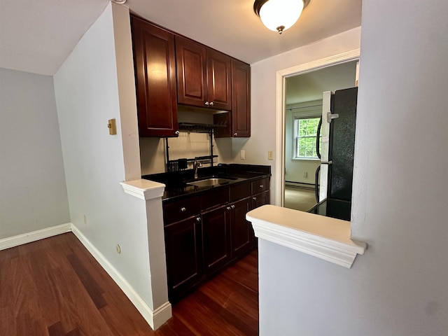 87 Cricketbrook Rd Unit 87, Dover, NH 03820 - kitchen featuring freestanding refrigerator, dark wood-type flooring, and a baseboard radiator