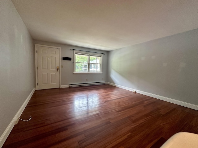 87 Cricketbrook Rd Unit 87, Dover, NH 03820 - unfurnished room featuring baseboard heating and dark wood finished floors