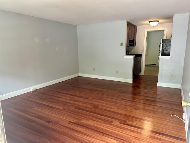 87 Cricketbrook Rd Unit 87, Dover, NH 03820 - empty room with dark wood finished floors and baseboard heating